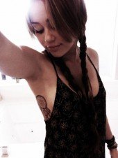 Miley Cyrus Shows Off Tattoo, While Organizing Bras