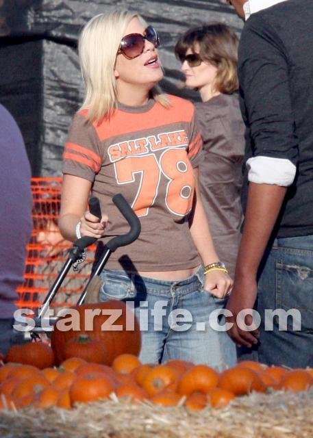 Tori and the Jerk O Lantern at the Pumpkin Patch.